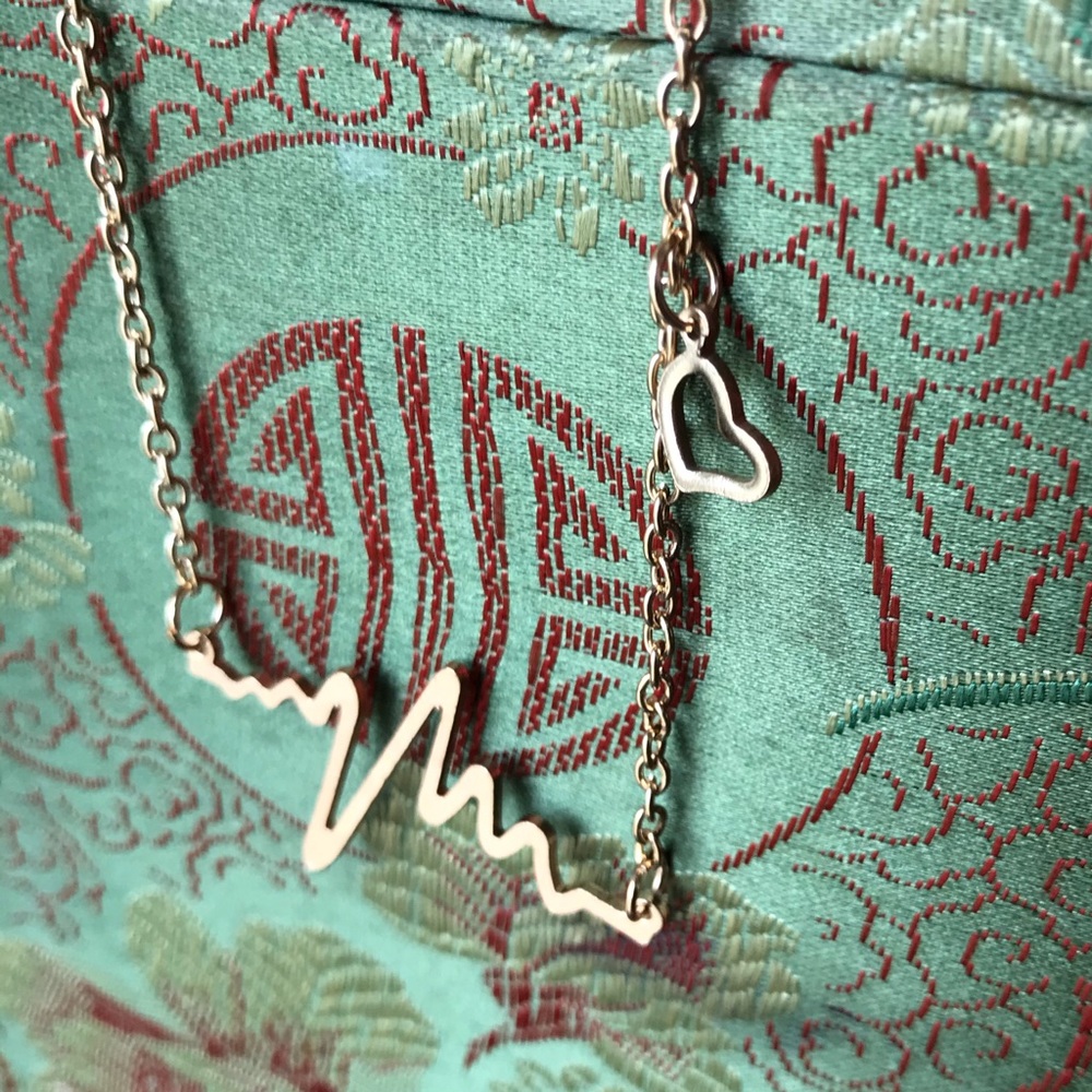 Gold heartbeat necklace